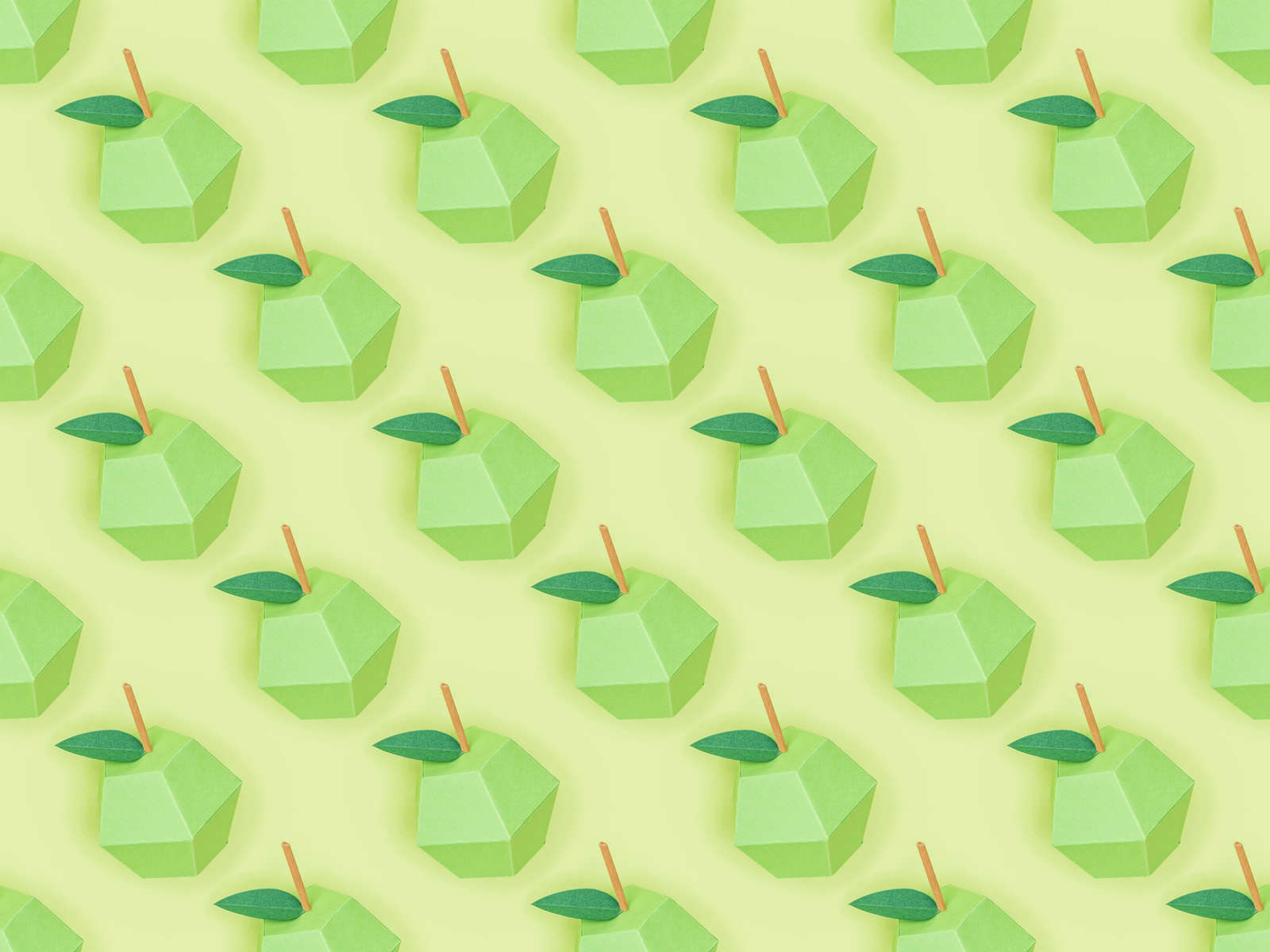 top view of pattern with handmade paper apples isolated on green